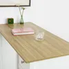 A close-up view of a wooden countertop with a book and a glass on it, part of a white cabinet is visible below. Produktbild-Vorschau