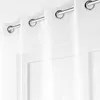 Close-up view of white curtains with grommets hanging from a curtain rod. Produktbild-Vorschau