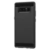A black phone case with a carbon fiber texture on the top and bottom edges, and a brushed metal texture on the main body. The camera cutout is visible at the top. Produktbild-Vorschau