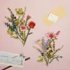 A flat lay of artificial flowers and a greeting card on a pink background. Podgląd zdjęcia produktu