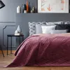 A bedroom scene with a bed and decorative items. Produktbild-Vorschau