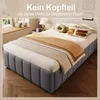 A bed without a headboard in a bedroom setting, with text overlay. Produktbild-Vorschau