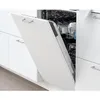 A white dishwasher door is open, revealing the interior with dishes inside. Voir les images du produit