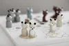 A close-up shot of a wooden board game with animal-themed playing pieces. Produktbild-Vorschau