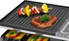 A close-up shot of a raclette grill with food cooking on it. Produktbild-Vorschau