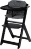 A black wooden high chair with a patterned seat cushion and tray. Produktbild-Vorschau