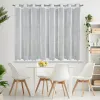 A white sheer curtain hangs over a window, with a dining table and chairs in front of it. Produktbild-Vorschau