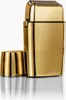A gold electric shaver with its cap off, placed on a reflective surface against a white background. Anteprima dell’immagine prodotto
