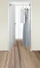 An open doorway with two dresses hanging on a rod inside. Produktbild-Vorschau