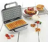 A waffle maker with freshly made waffles and toppings. Produktbild-Vorschau