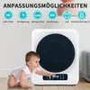 A baby is reaching for a white appliance with a black circular front, likely a dryer or sterilizer, with text overlays describing its features. Produktbild-Vorschau