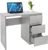 A modern gray desk with a concrete look, featuring a laptop and a potted plant.