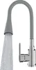 A modern kitchen faucet with a flexible gray spout and a chrome base, with water flowing from the spout. Podgląd zdjęcia produktu