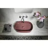 A bathroom sink with a faucet and a vase of flowers. Produktbild-Vorschau