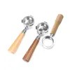 Three espresso portafilters with wooden handles on a white background. Podgląd zdjęcia produktu