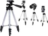 Four different tripods are displayed against a white background. One tripod holds a GoPro camera, another holds a DSLR camera, and the third holds a smartphone. The fourth tripod is empty. Anteprima dell’immagine prodotto