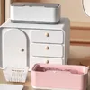 A collection of cleaning devices and storage units on a desk. Náhled obrázku produktu