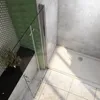 A modern bathroom shower enclosure with a glass door and a white shower tray. Produktbild-Vorschau