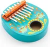 A teal kalimba with orange and yellow owl decorations. Anteprima dell’immagine prodotto