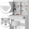 A white vanity table with drawers and shelves, a stool, and makeup accessories. Voir les images du produit