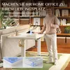 A man is standing next to a height-adjustable desk in a home office setting, with a sofa and bookshelves in the background. Close-up insets show desk features. Produktbild-Vorschau