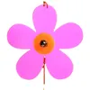 A close-up of a pink flower-shaped suncatcher with an orange center. Produktbild-Vorschau