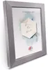 A silver picture frame with a "Save the Date" card inside, set against a white background. Produktbild-Vorschau