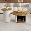 A living room scene with two round coffee tables in front of a white sofa. Produktbild-Vorschau