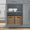 Geöffneter Schrank der SoBuy Kücheninsel FKW129-HG mit Geschirr, Gläsern und Weidenkörben Anteprima dell’immagine prodotto