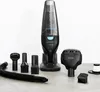 A black handheld vacuum cleaner and its accessories are displayed on a gray surface against a white background. Voir les images du produit