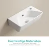 A white ceramic sink mounted on a light beige wall. Anteprima dell’immagine prodotto
