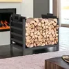 A metal firewood rack filled with logs next to a fireplace. Náhľad obrázku produktu