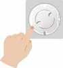 A hand is shown pressing a button on a white electrical outlet cover. Produktbild-Vorschau