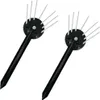 Two black garden stakes with silver prongs. Náhled obrázku produktu