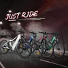 Four electric mountain bikes lined up in a tunnel with smoke and spotlights. Produktbild-Vorschau