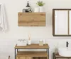 A bathroom setting with a wall-mounted cabinet, vanity, and sink. Produktbild-Vorschau
