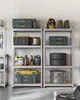 A storage unit filled with various items in a garage or workshop. Produktbild-Vorschau
