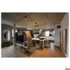 A modern living room with a TV, dining table, and kitchen area. Produktbild-Vorschau