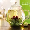 A blooming tea flower in a glass teapot. Produktbild-Vorschau