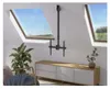 A TV ceiling mount is installed in a room with skylights and a TV stand. Podgląd zdjęcia produktu