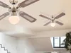 Two ceiling fans with lights are shown in a room with a staircase and a window. Náhľad obrázku produktu