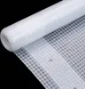 A roll of white tarp material with a grid pattern is shown against a black background. Produktbild-Vorschau
