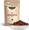 A bag of hibiscus tea and a bowl of the tea leaves. Produktbild-Vorschau