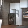 A modern bathroom with a washing machine and white cabinets. Náhled obrázku produktu