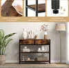 A console table with decorative items and a floor lamp in a room setting. Produktbild-Vorschau