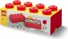 A product box designed to look like a large LEGO brick, filled with smaller LEGO bricks. Voir les images du produit