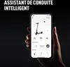 A hand holding a smartphone displaying an app interface for an electric scooter, with text overlayed on the image. Voir les images du produit