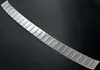 A silver-colored car accessory, likely a bumper protector, is shown against a black background. Anteprima dell’immagine prodotto
