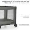 A close-up view of a grey travel crib with text overlays highlighting its features. Podgląd zdjęcia produktu