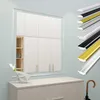 A large mirror with a white frame is mounted above a dresser. Several decorative trim pieces in different colors and finishes are displayed on the right side of the image. Produktbild-Vorschau
